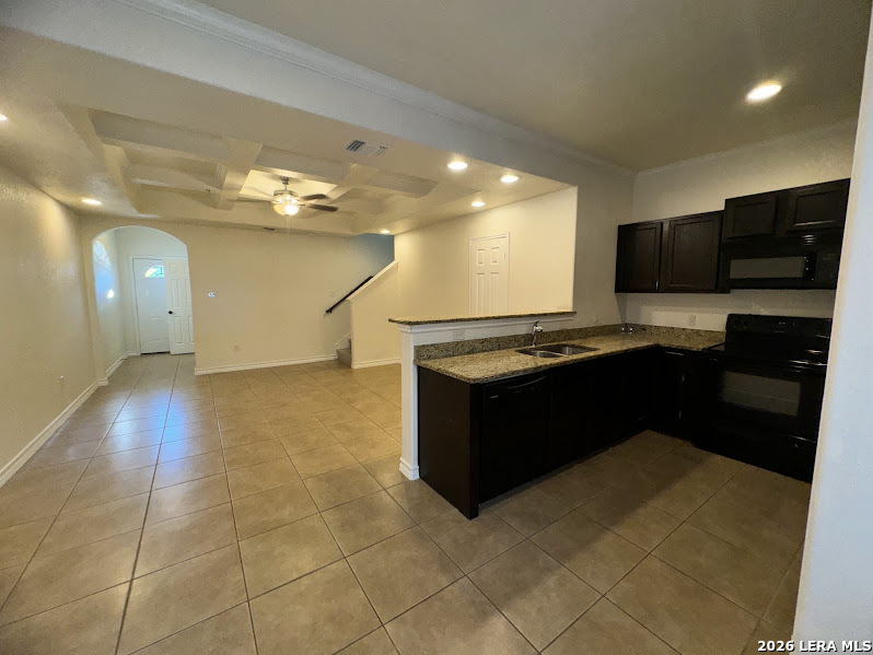 16808 Dancing Ava, Unit 2 Selma, TX 78154 - Photo 4 of 15 a kitchen with a sink and cabinets