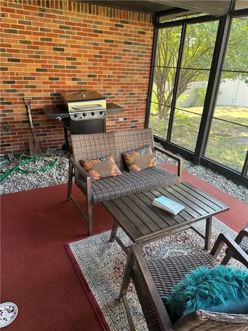 a view of barbeque area with seating