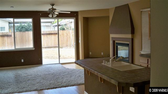 10535 Meeks Bay Court Reno, NV 89521 - Photo 3 of 9 a bathroom with a granite countertop sink and a mirror