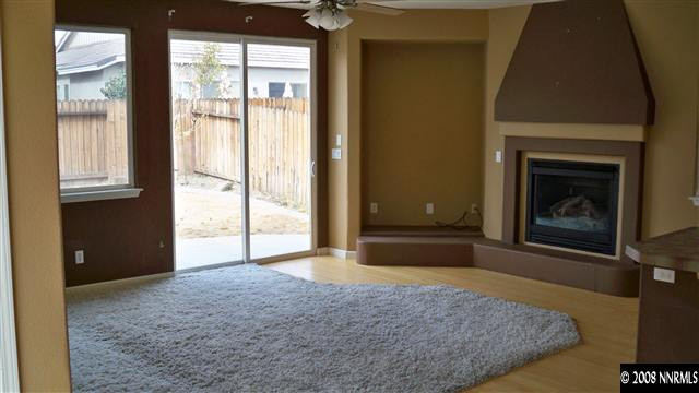 10535 Meeks Bay Court Reno, NV 89521 - Photo 4 of 9 a view of livingroom with window and fireplace