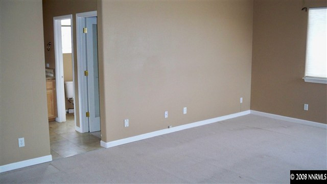 10535 Meeks Bay Court Reno, NV 89521 - Photo 6 of 9 an empty room with windows and closet