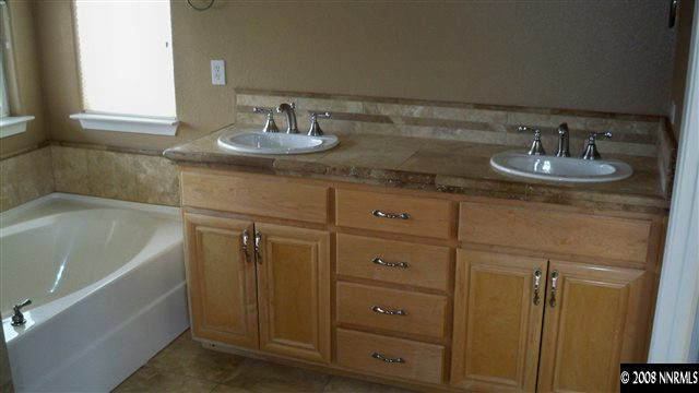 10535 Meeks Bay Court Reno, NV 89521 - Photo 8 of 9 a bathroom with a sink and a tub