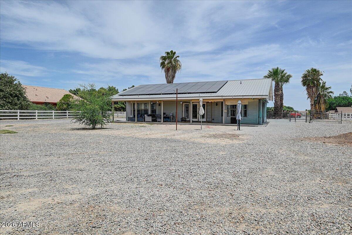7624 North Citrus Road Waddell, AZ 85355 - Photo 37 of 57 a front view of a house with a yard
