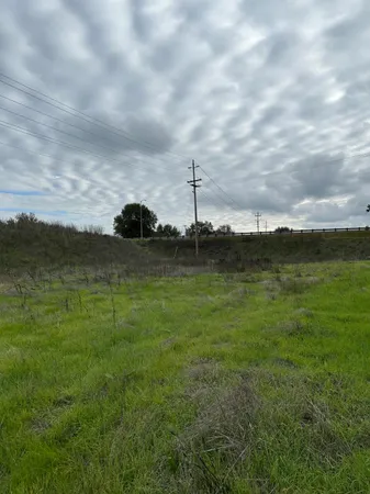 a view of a lake with a big yard