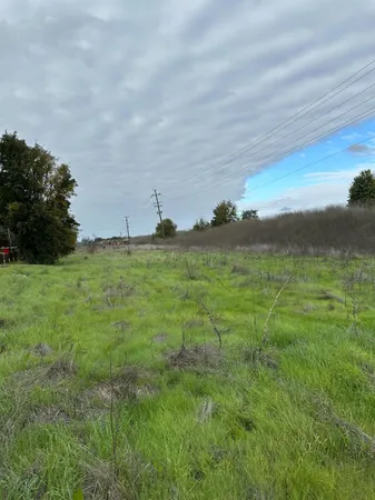 a view of a lake with a yard