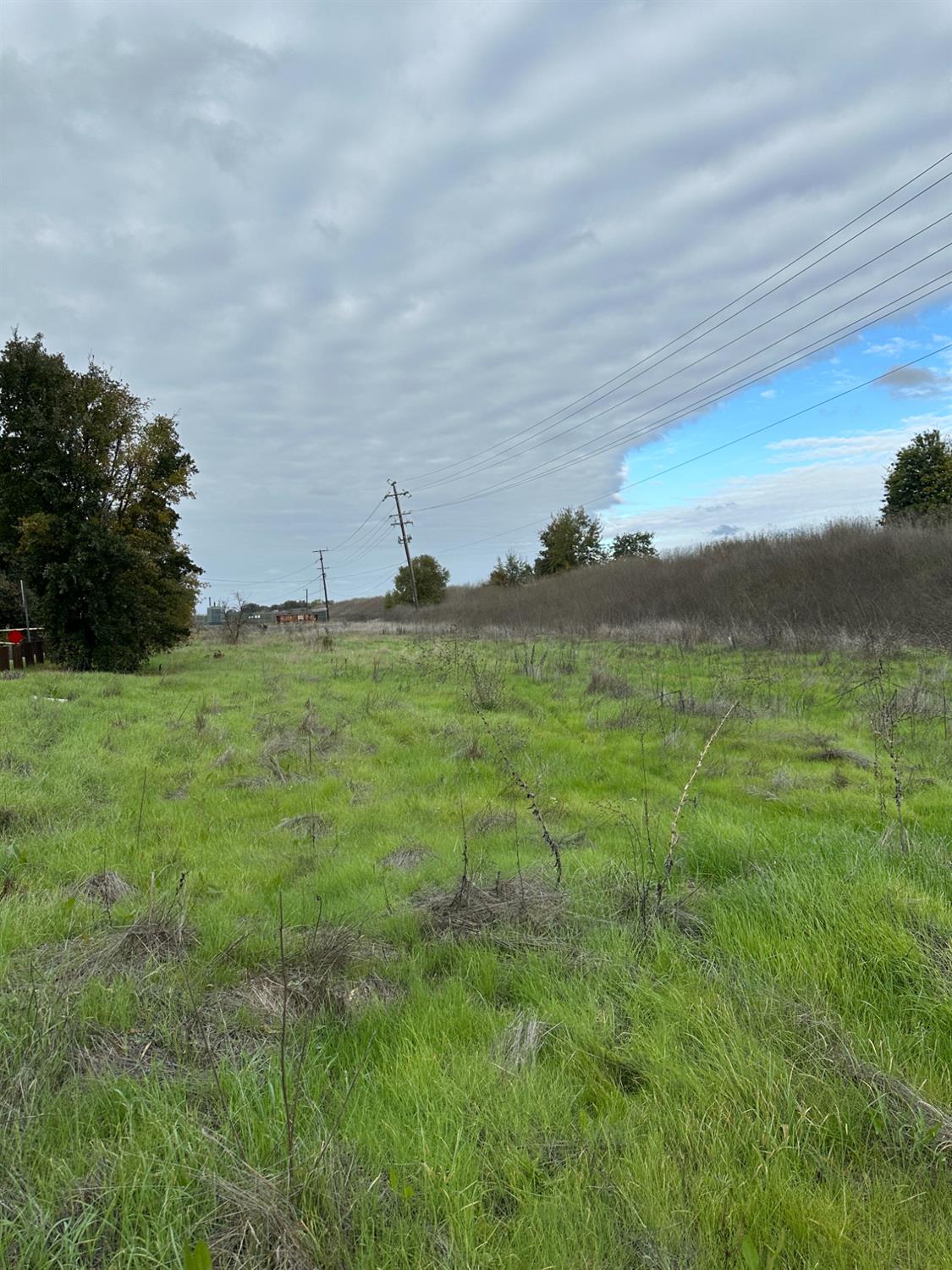 0 9th Street Hood, CA 95639 - Photo 7 of 8 a view of a lake with a yard