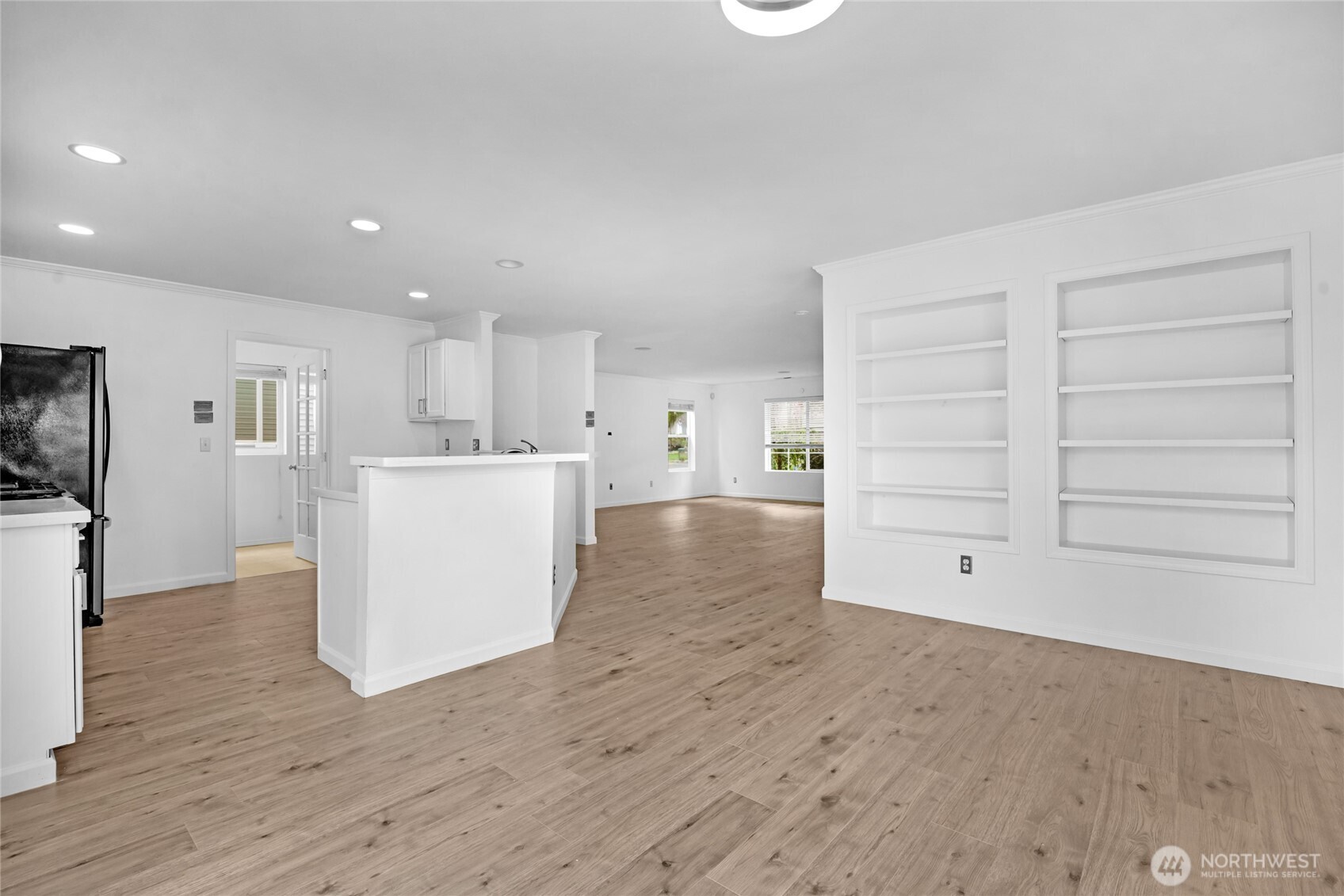 3903 154th Place Southeast Bothell, WA 98012 - Photo 5 of 30 a view of a kitchen with fridge and wooden floor