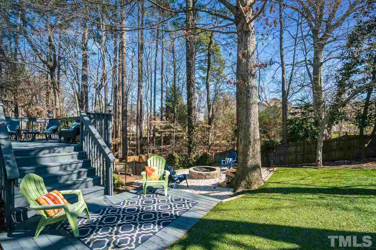 8727 Harps Mill Road Raleigh, NC 27615 - Photo 22 of 25 a view of outdoor space yard deck patio and swimming pool