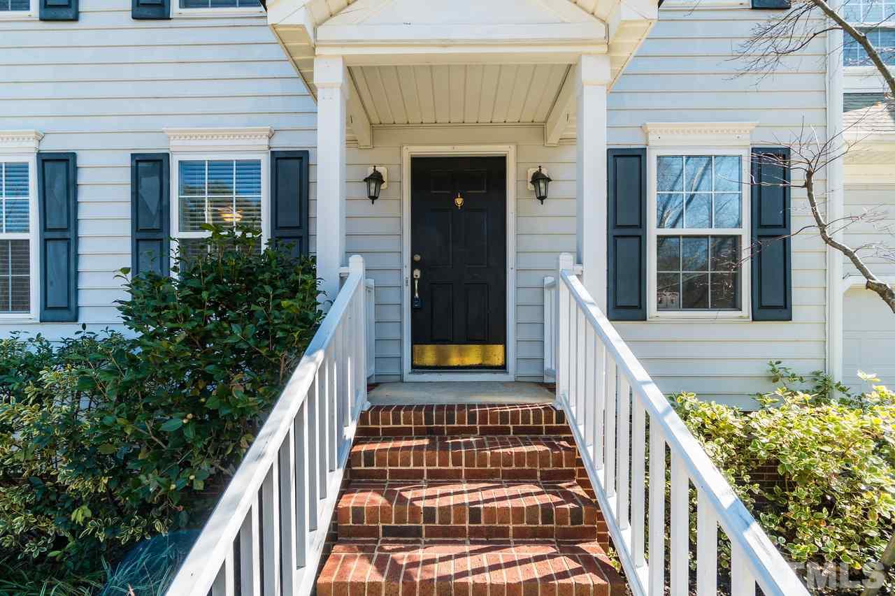 8727 Harps Mill Road Raleigh, NC 27615 - Photo 4 of 25 a front view of a house with a porch