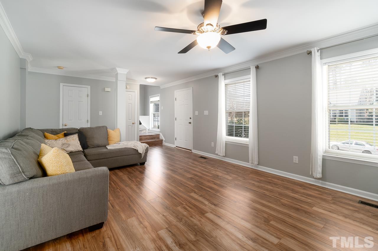 8727 Harps Mill Road Raleigh, NC 27615 - Photo 5 of 25 a living room with furniture and a window
