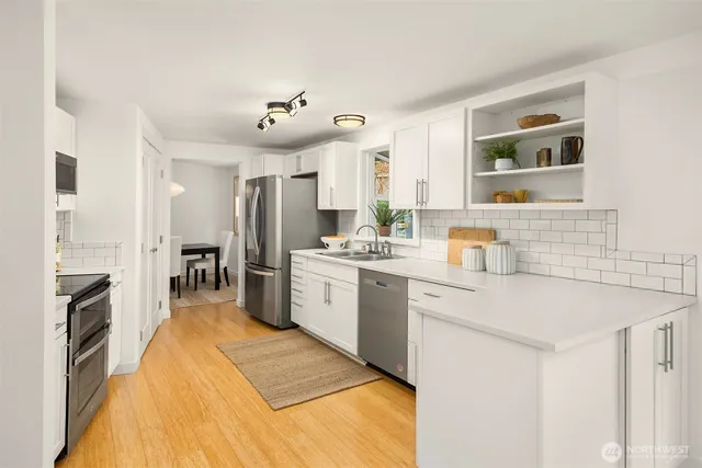 a kitchen with a sink stove and refrigerator