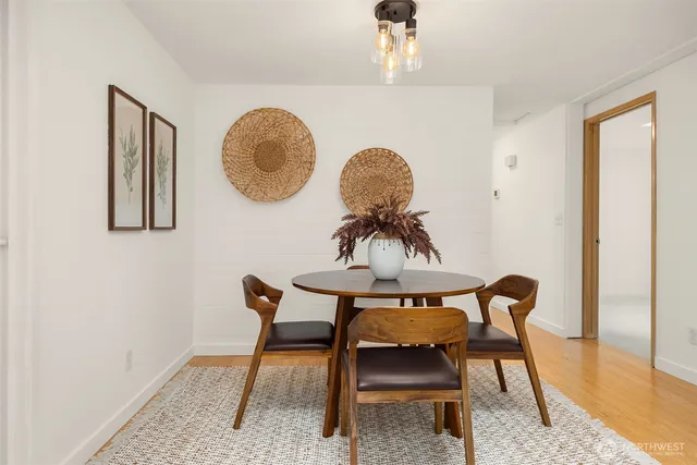 a view of a room with furniture and wooden floor
