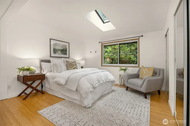 a bedroom with a bed and a couch