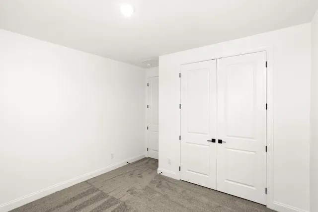 a bathroom with a bathtub shower sink vanity and toilet