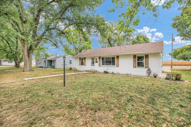 a house with trees in the background
