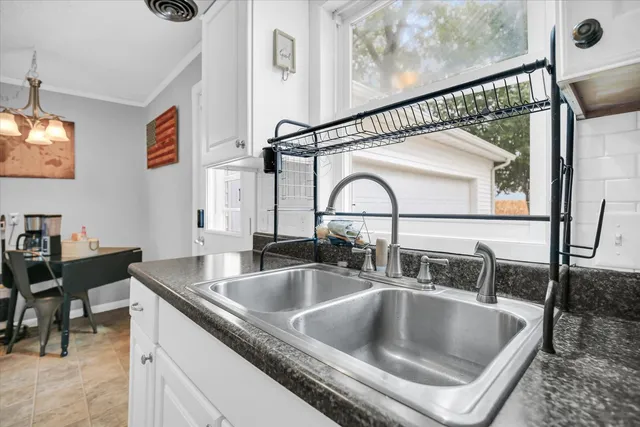 a kitchen with a sink and a refrigerator
