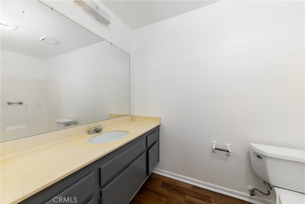 1800 East Old Ranch Road, Unit 134 Colton, CA 92324 - Photo 16 of 22 a bathroom with a sink and a toilet