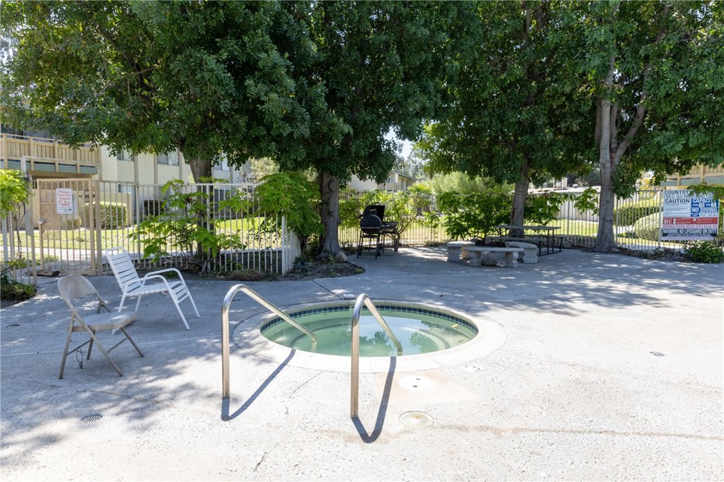 1800 East Old Ranch Road, Unit 134 Colton, CA 92324 - Photo 21 of 22 a view of swimming pool with table and chairs