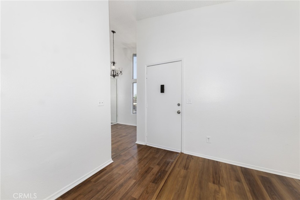 1800 East Old Ranch Road, Unit 134 Colton, CA 92324 - Photo 5 of 22 a view of a hallway with wooden floor