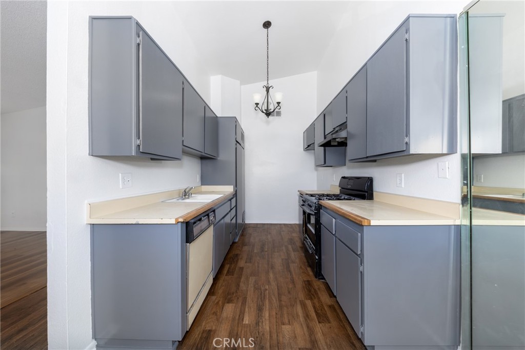 1800 East Old Ranch Road, Unit 134 Colton, CA 92324 - Photo 10 of 22 a kitchen with a stove and a sink