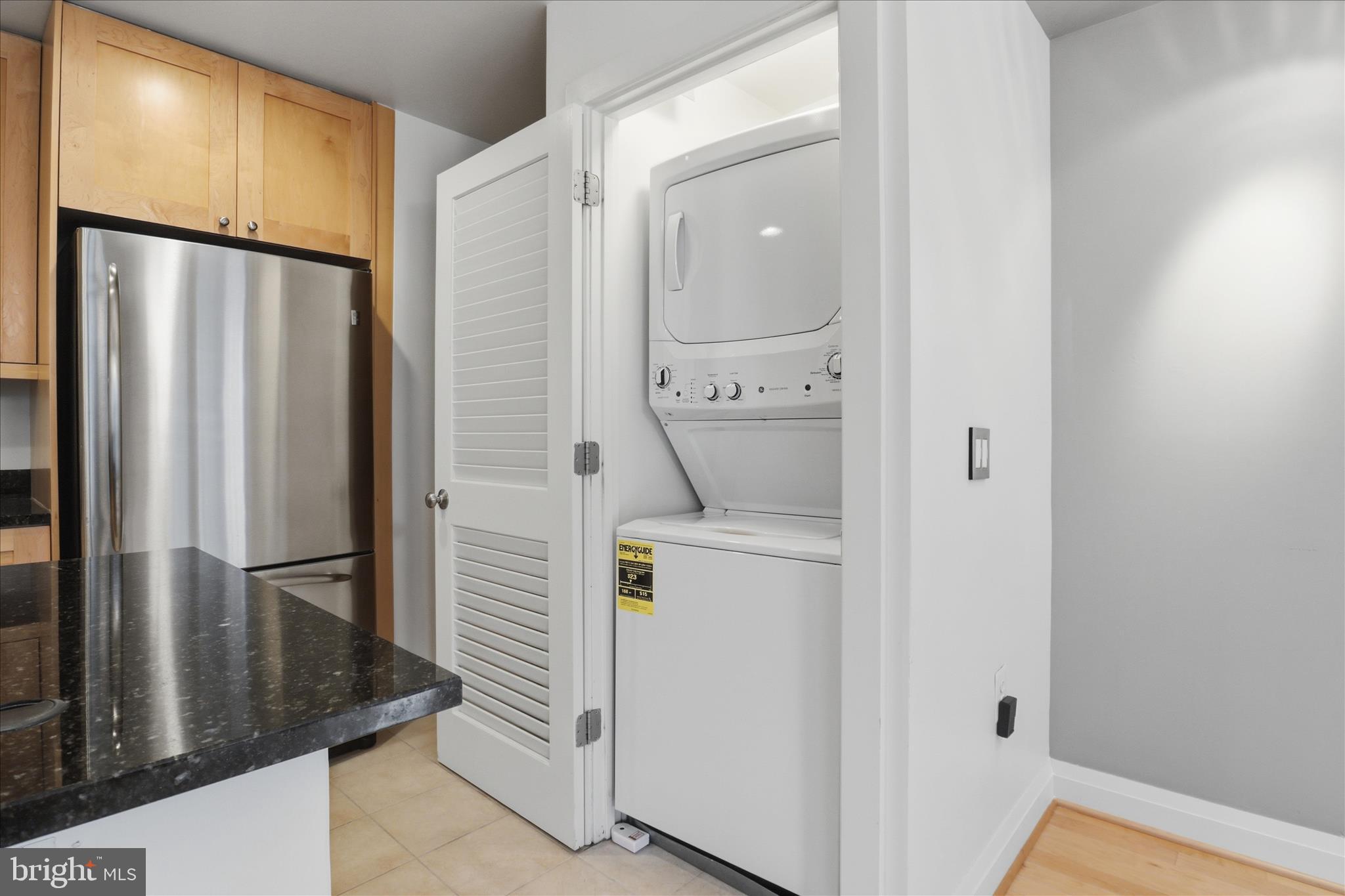11990 Market Street, Unit 216 Reston, VA 20190 - Photo 32 of 41 a utility room with dryer and washer