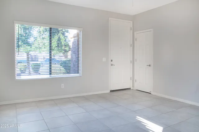 a view of an empty room with a window