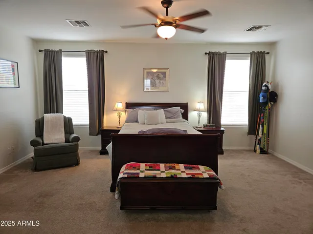 a bedroom with furniture and window