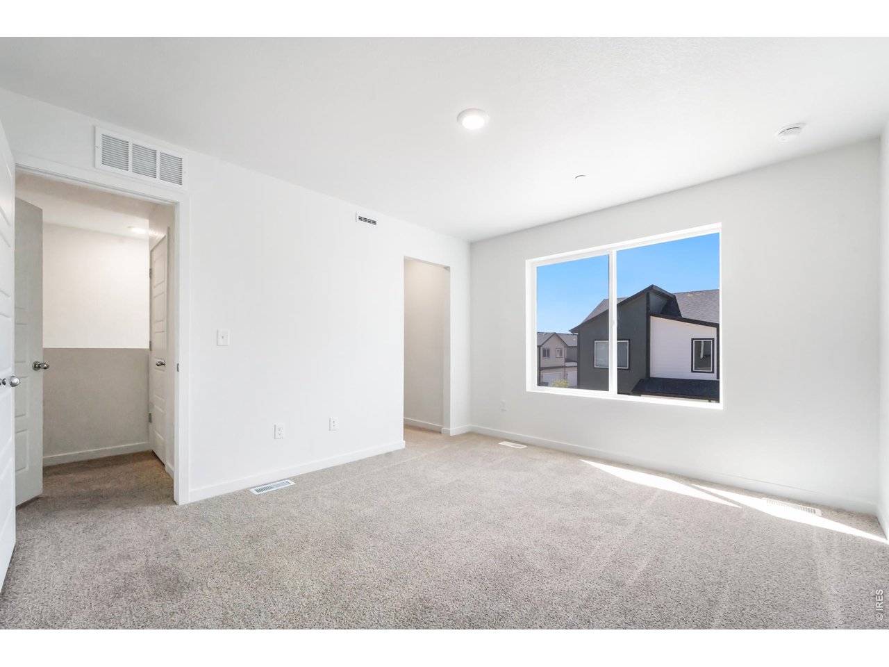 3913 Net Street Evans, CO 80620 - Photo 11 of 19 a view of an empty room with a window