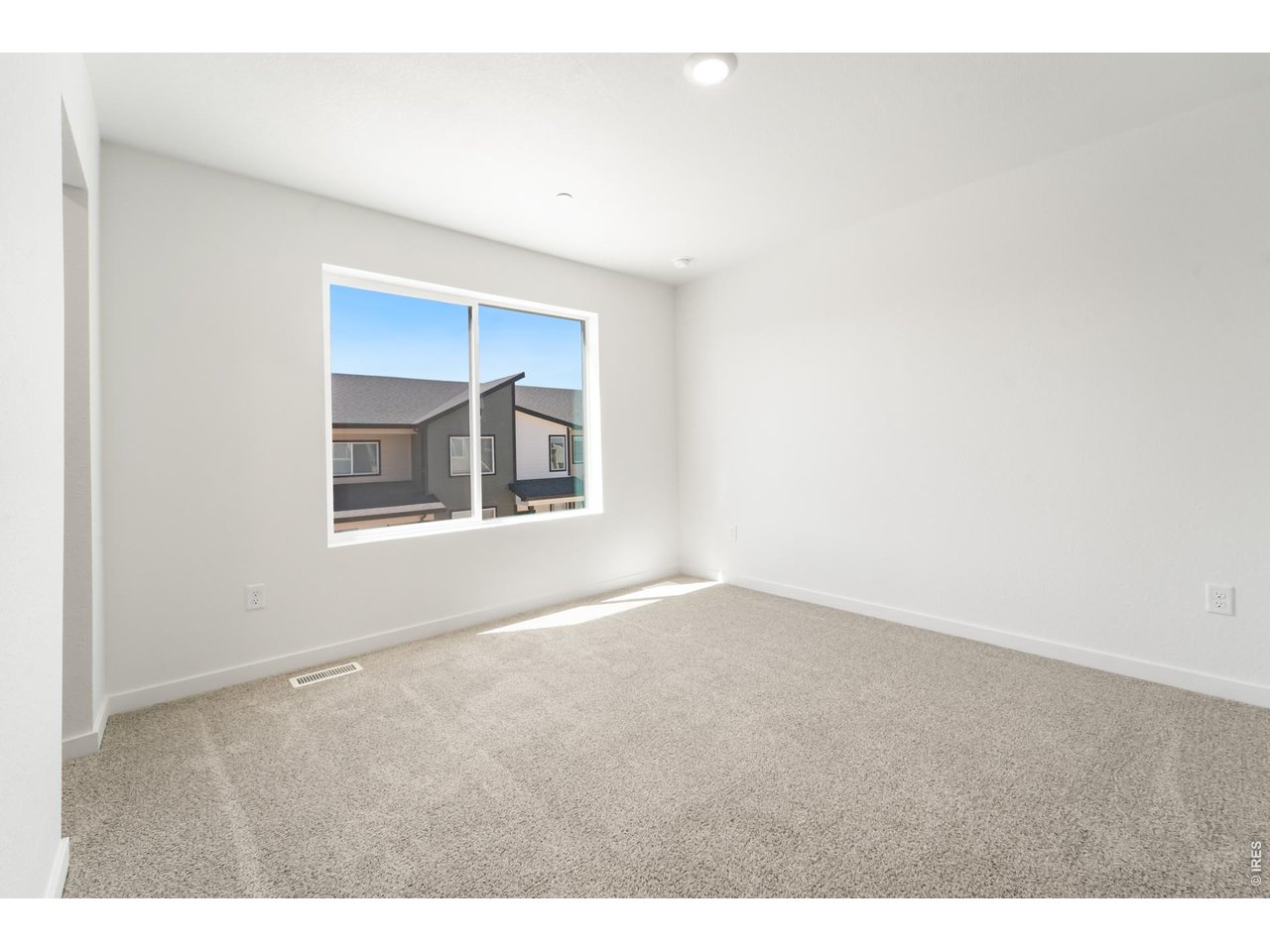 3913 Net Street Evans, CO 80620 - Photo 13 of 19 an empty room with windows and closet