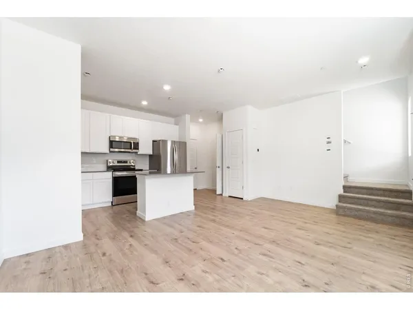 a view of kitchen with stainless steel appliances kitchen island