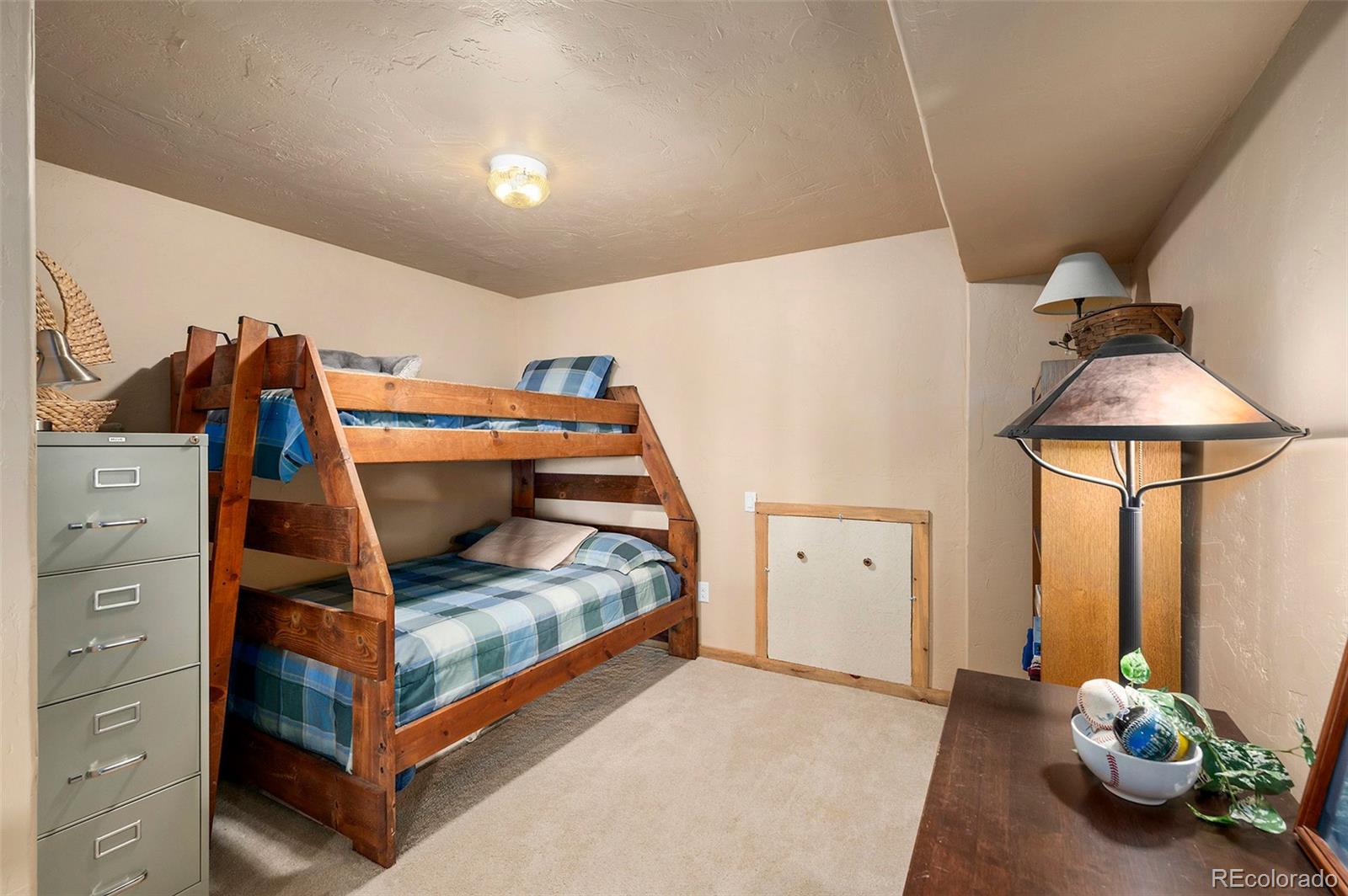 290 Village Road Granby, CO 80446 - Photo 29 of 45 a bedroom with bed and window
