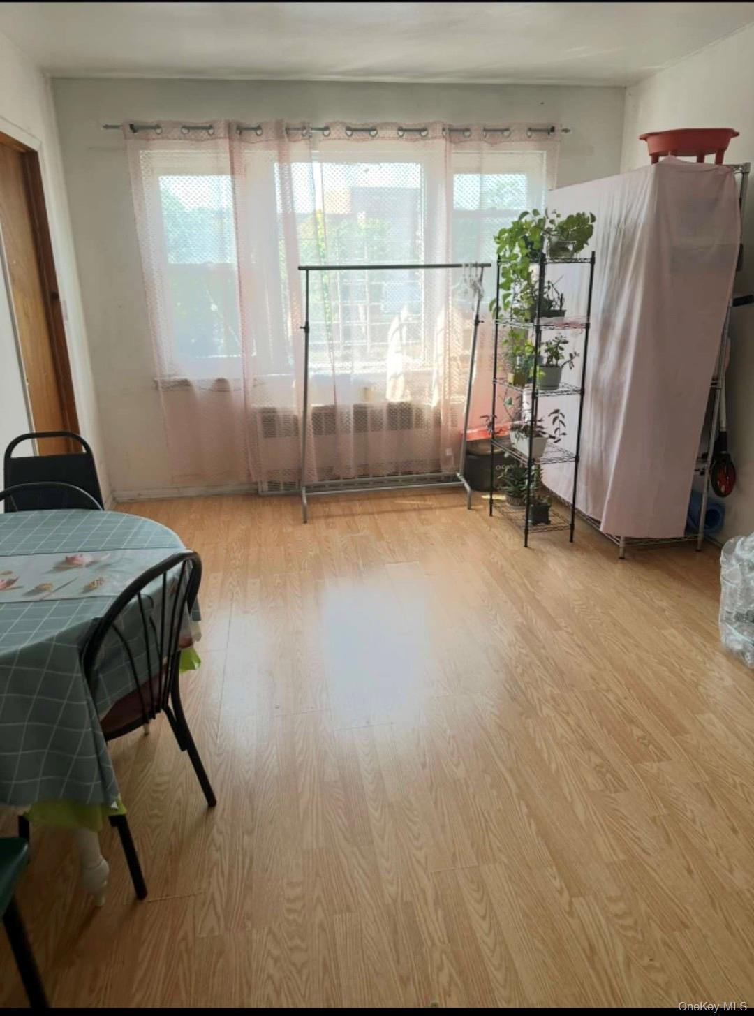 153-51 Horace Harding Expressway Queens, NY 11367 - Photo 7 of 11 Dining room featuring light wood-style flooring