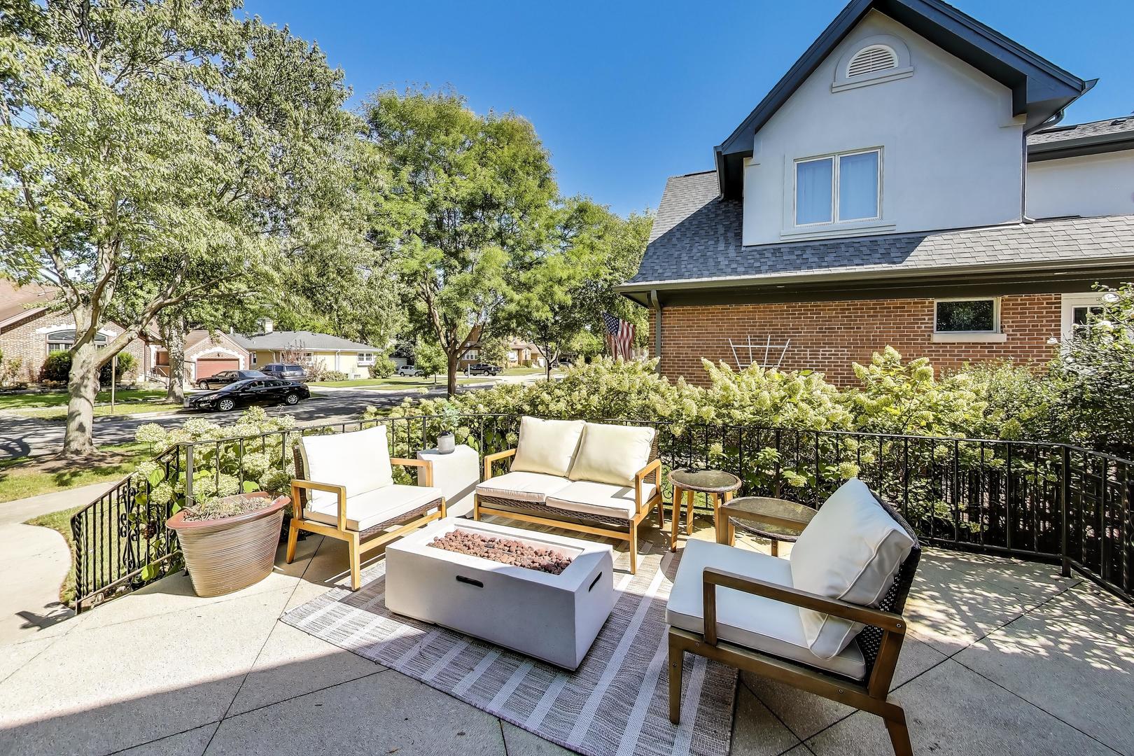 211 Imperial Street Park Ridge, IL 60068 - Photo 3 of 28 a backyard of a house with outdoor seating