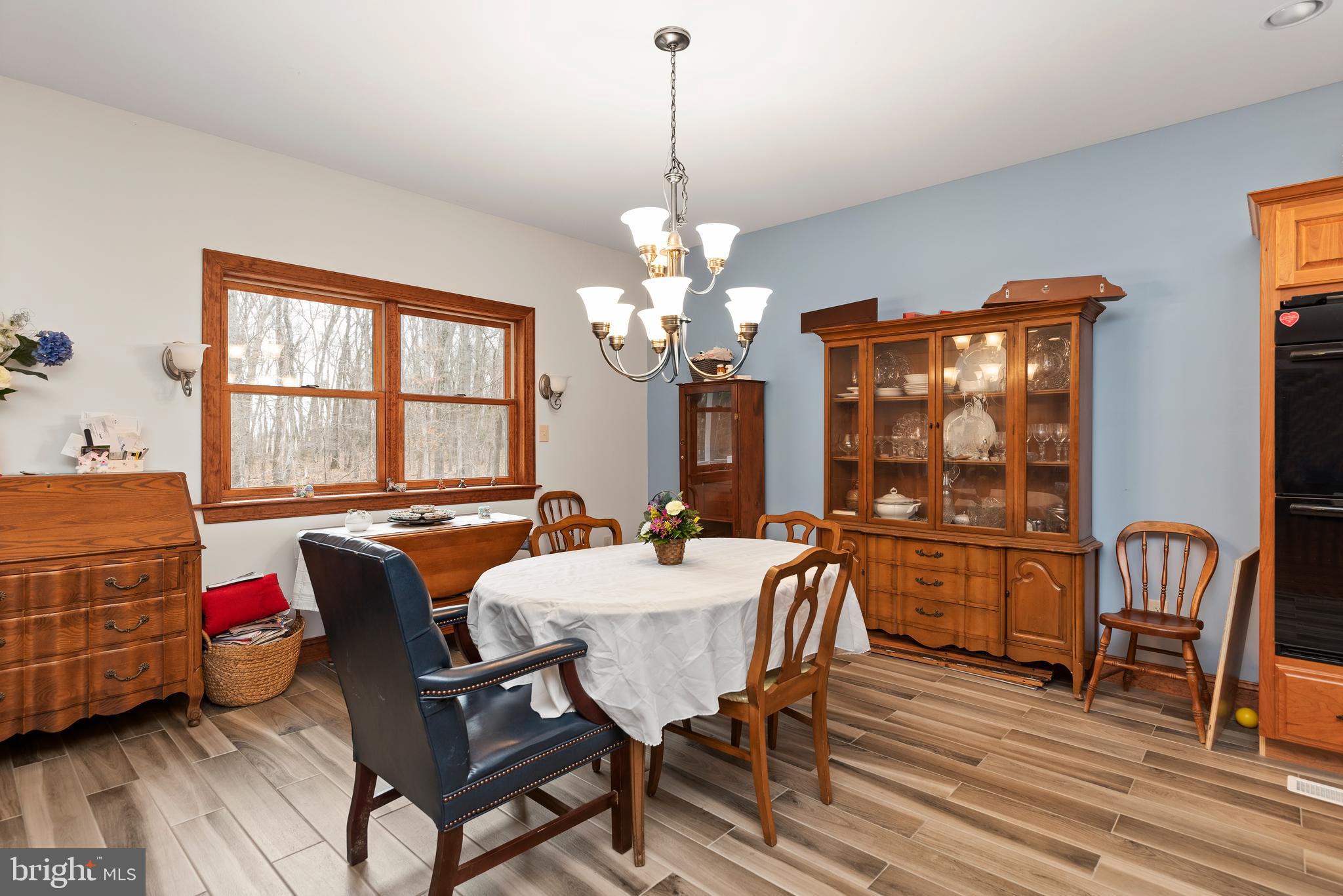 1370 Indian Peg Road Boiling Springs, PA 17007 - Photo 15 of 44 Spacious dining area with peaceful view of woods
