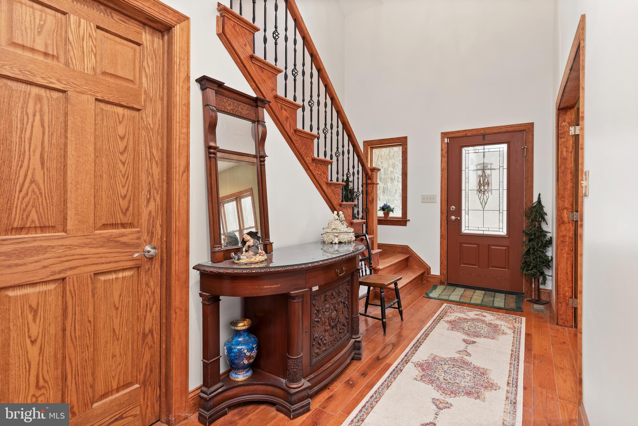 Expansive entry with hardwood flooring