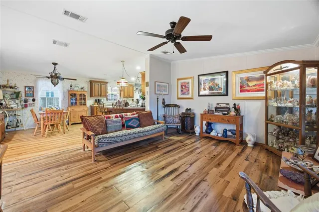 a living room with furniture a rug and a large window