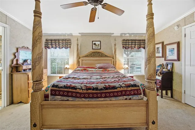 a bedroom with a bed dresser and a window