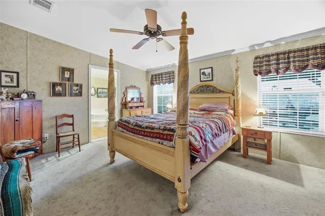a bathroom with a sink a bathtub and a double vanity sink