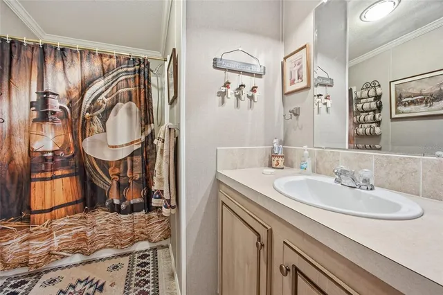 a view of a livingroom with workspace and a window