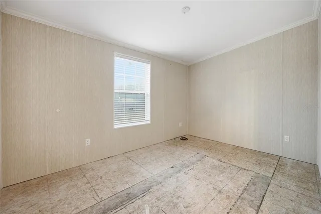 a view of an empty room and window