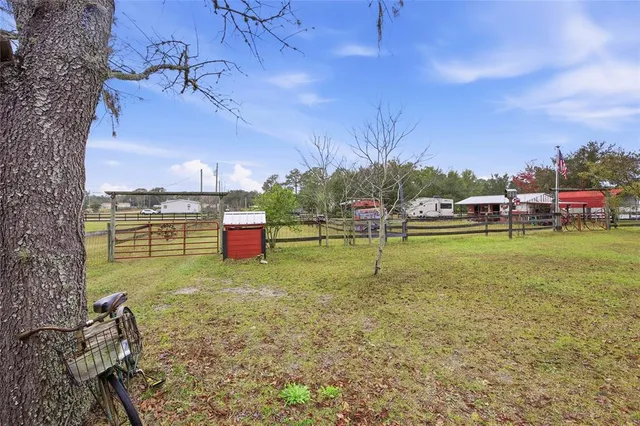 a view of a garden with a building in the background