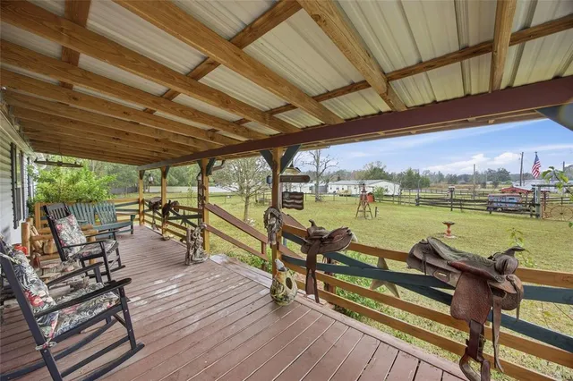 a view of a patio with table and chairs