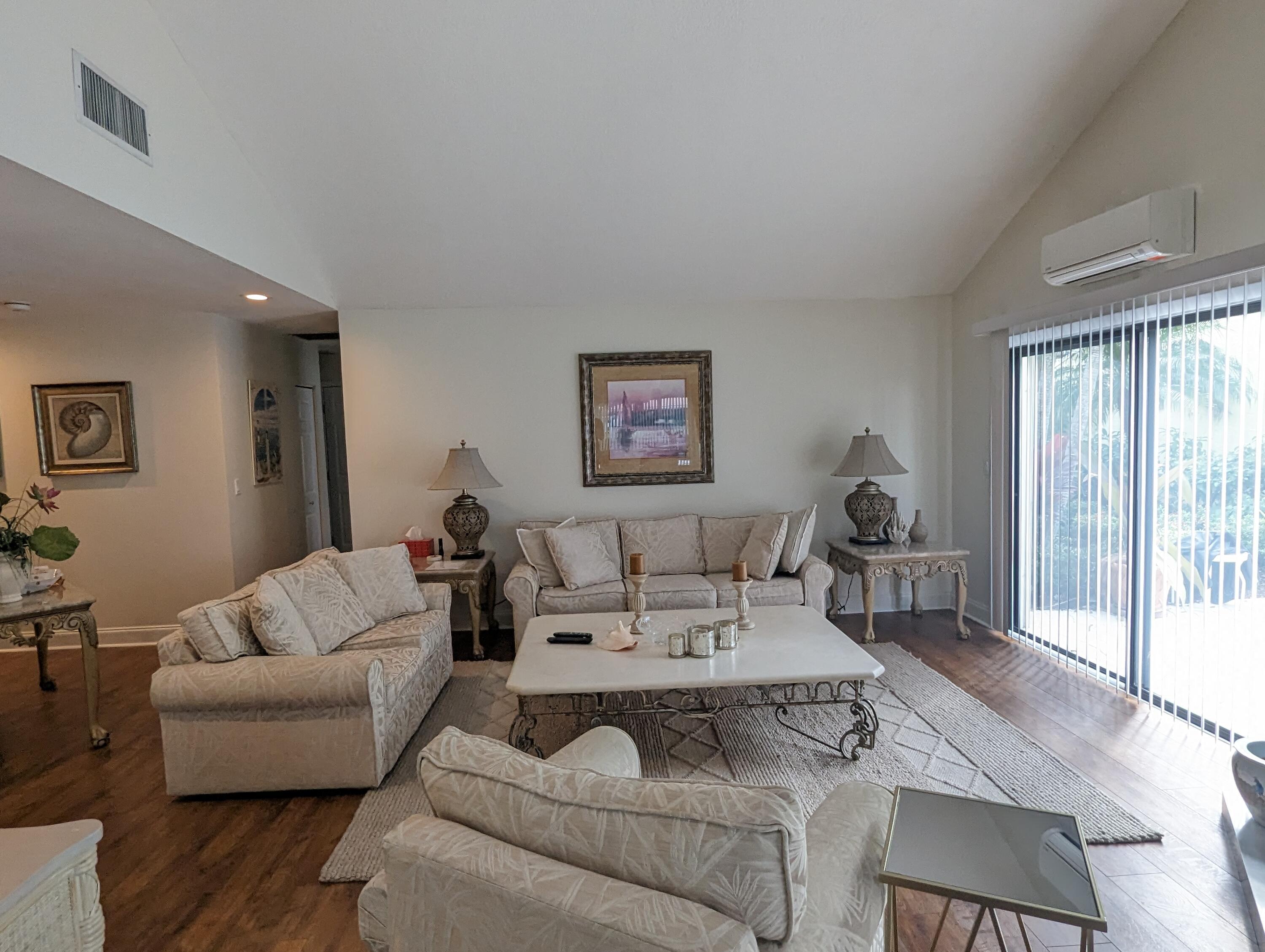 17042 Traverse Circle Jupiter, FL 33477 - Photo 4 of 30 a living room with furniture and a large window