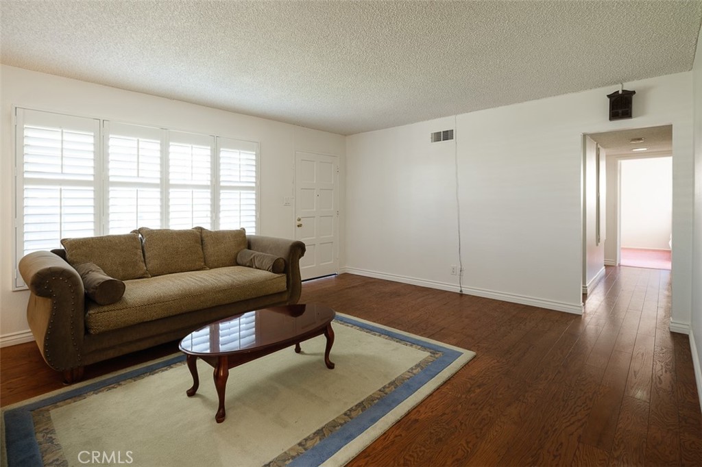 9716 Loftus Drive Rosemead, CA 91770 - Photo 14 of 28 a living room with furniture and a window