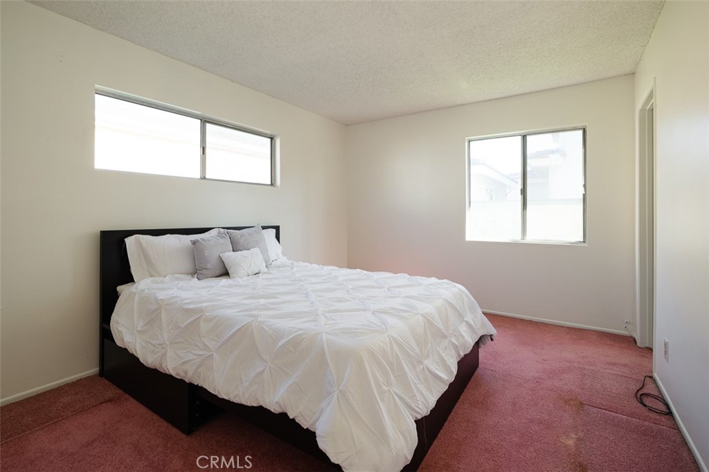 9716 Loftus Drive Rosemead, CA 91770 - Photo 15 of 28 a bedroom with a bed and window