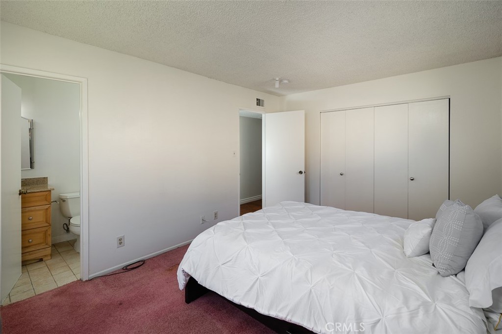 9716 Loftus Drive Rosemead, CA 91770 - Photo 16 of 28 a bedroom with a bed and a cabinets