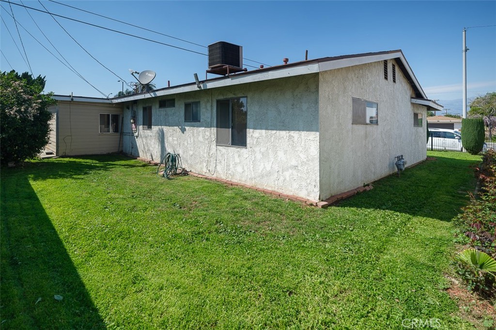 9716 Loftus Drive Rosemead, CA 91770 - Photo 23 of 28 a front view of a house with a yard