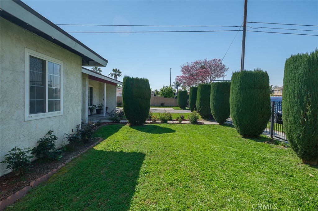 9716 Loftus Drive Rosemead, CA 91770 - Photo 4 of 28 a view of a house with backyard and a garden