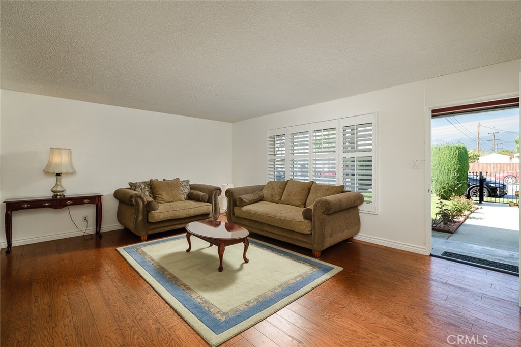 9716 Loftus Drive Rosemead, CA 91770 - Photo 6 of 28 a living room with furniture and wooden floor