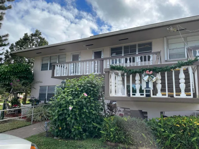 front view of a house with a garden